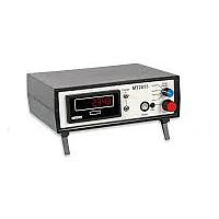 Technician servicing a tachometer calibrator in a calibration and repair environment